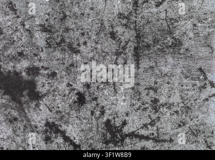 Grunge gray metal background or texture with scratches and cracks, close up, top view Stock Photo