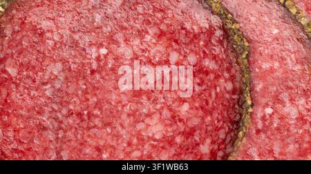 Pepper salami cuts isolated, thin sausage slices. Sliced dry chorizo, sausages round pieces, pepperoni pizza ingredient top view, white background Stock Photo