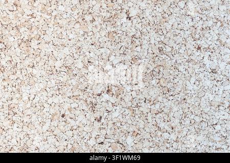 Light Brown corkboard texture with an empty pinboard surface provides a versatile backdrop presentation concepts. Stock Photo