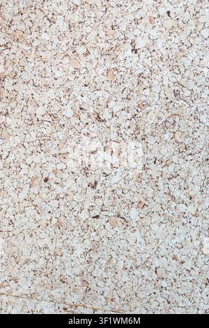 Light Brown corkboard texture with an empty pinboard surface provides a versatile backdrop presentation concepts. Stock Photo