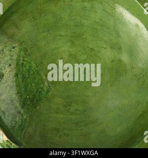 An overhead macro shot showing the textured glaze and subtle imperfections on the surface of a vintage green ceramic plate Stock Photo