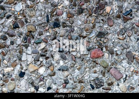 Exposed Aggregate Concrete Texture with Colorful Pebble Stones Stock Photo