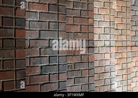 Rhythmic Red Brick Wall Columns Architecture Texture with Harsh Shadows Stock Photo