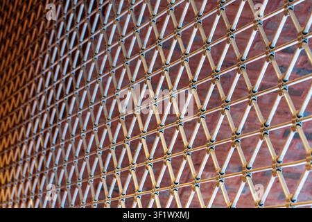 Perspective View of Metal Security Grille Gate with Brick Wall Stock Photo