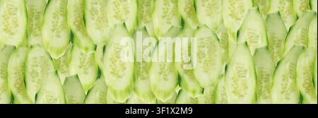 Cucumber cut isolated, cucumber round slices, green vegetable cuts for salad isolated, healthy natural plant pieces, macro cucumbers slicing on white Stock Photo