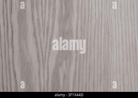 Vertical close up of a smooth light grey wood grain texture showing elegant natural parallel patterns on a modern ash or oak timber panel background. Stock Photo