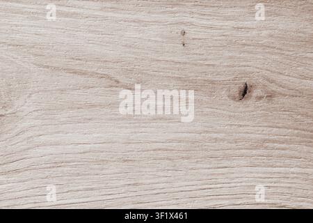 Horizontal close up of a light beige wood grain texture with a small dark knot and soft organic lines on a clean natural maple or pine timber backgrou Stock Photo