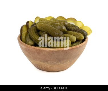 Pickled sliced cucumbers in wood bowl isolated. fermented food, marinated canned vegetables, gherkins, pickled cucumbers on white background Stock Photo