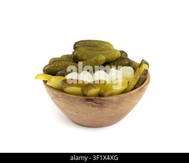 Pickled sliced cucumbers in wood bowl isolated. fermented food, marinated canned vegetables, gherkins, pickled cucumbers on white background Stock Photo