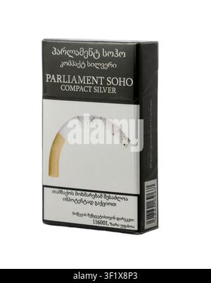 Parliament Soho Compact Silver cigarettes in a sleek black package displayed on a neutral background Stock Photo
