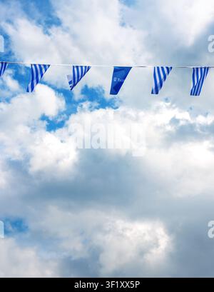 Tallinn, Estonia, August 31, 2024. Tallinn city flags and logo bunting against cloudy sky in Estonia Stock Photo