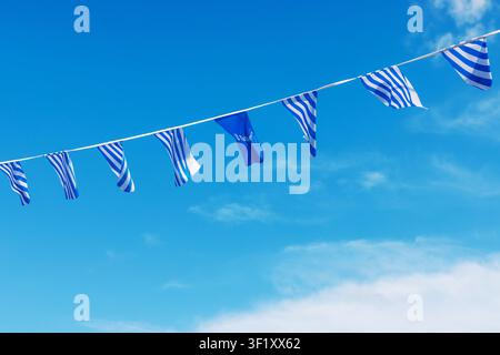 Tallinn, Estonia, August 31, 2024. Tallinn city flags and logo bunting against  bright blue sky with white clouds Stock Photo