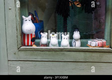 Tallinn, Estonia, August 31, 2024. Moomin character figurines and collectible decorations displayed in a souvenir shop window. Stock Photo