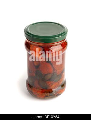 Dry Tomatoes in Jar Isolated, Sun Dried Pomodoro Preserve, Dehydrated Tomato In Olive Oil, Cured Sundried Vegetable Slices, Dry Plum Tomatoes in Glass Stock Photo