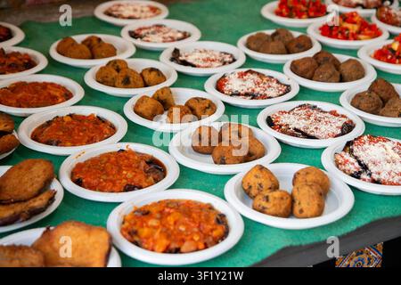 Ballaro Market Palermo street food stall with wine and assorted sicilian street food. Stock Photo