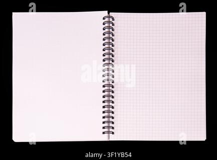 Minimalist spiral notebook with graph paper pages, centered composition, high-contrast black background, standard grid pattern, even diffused lighting Stock Photo