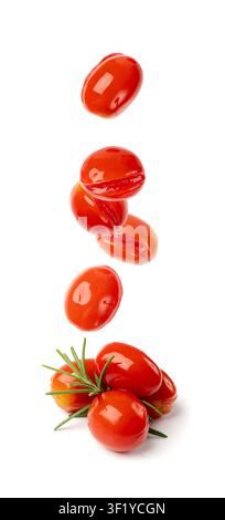 Falling Pickled Cherry Tomatoes Isolated, Flying Small Tomato, Healthy Fermented Vegetables, Salted Marinated Food, Pickled Tomatoes on White Backgrou Stock Photo