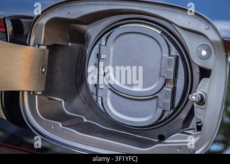 Close-up of an electric vehicle charging port with the cover closed Stock Photo
