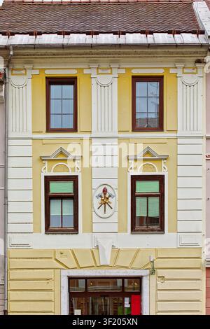 153 Former Volunteer Firefighters house built in 1906 on Mestni trg square E side wedged between two XVI c.Renaissance buildings. Skofja Loka-Slovenia Stock Photo