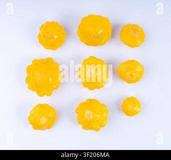 Marinated patty pan isolated, pickled pattypan squash, salted yellow patisson, fermented baby scallop, custard granny squash on white background Stock Photo