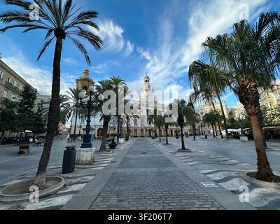 Cadiz, Andalusia, Spain - 26 October 2025: View of the historic Plaza de las Flores with its iconic palm trees, ornate street lamps, and traditional a Stock Photo