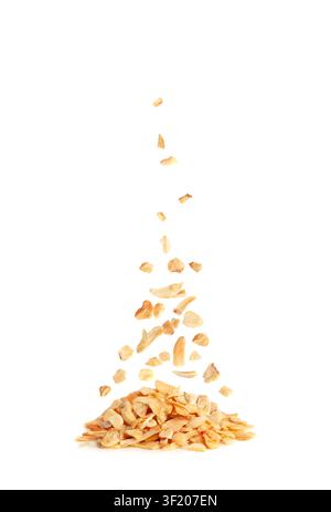 Falling Dry Garlic Slices Isolated, Flying Crispy Fried Cloves Pile Closeup, Roasted Grilled Garlic Flakes, Clove Chip Group on White Background Stock Photo