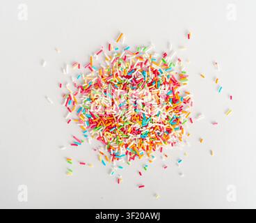 Candy Sprinkle Pile, Donut Rainbow Sprinkles Isolated, Sweet Color, Many Small Vermicelli on White Background Top View Stock Photo