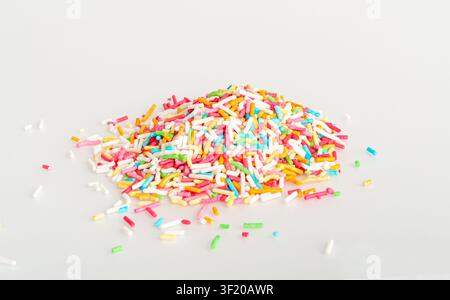 Candy Sprinkle Pile, Donut Rainbow Sprinkles Isolated, Sweet Color, Many Small Vermicelli on White Background Stock Photo