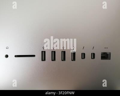 Row of USB and Thunderbolt ports on the back panel of an computer Stock Photo