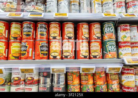 Canned soups shelf in Wellcome supermarket Hong Kong: Heinz brand canned soups, including Tomato, Chicken, and Big Soup varieties Stock Photo