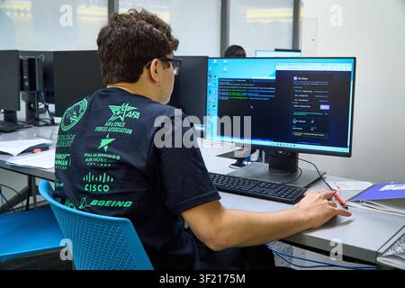 Palm Desert, California, USA. 14th July, 2026. A student participates in the Air & Space Forces Association Palm Springs Chapter 134 Summer Cyber Camp at the College of the Desert Information Technology Center, working on a hands-on cybersecurity exercise at a computer workstation. The week-long program introduces high school students to cybersecurity, computer networking, coding, artificial intelligence, and cyber defense through instruction from industry professionals and AFA volunteers. (Credit Image: © Ian L. Sitren/ZUMA Press Wire) EDITORIAL USAGE ONLY! Not for Commercial USAGE! Stock Photo