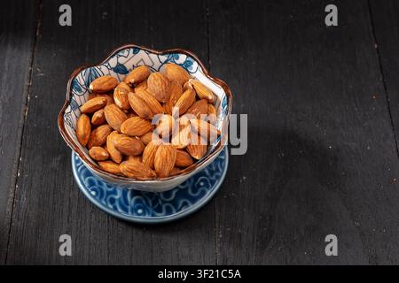 Whole shelled almond kernels roasted nuts isolated on white background Stock Photo
