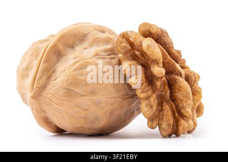 Whole walnuts and cracked walnut kernel isolated on white background Stock Photo