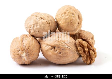 Whole walnuts and cracked walnut kernel isolated on white background Stock Photo