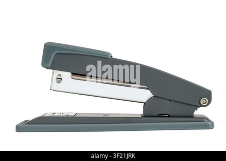 Modern office stapler on a white background. Stapler close-up side view. Stock Photo