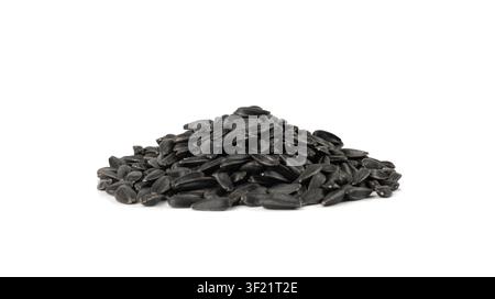 Sunflower seeds pile isolated, black sun flower grains snack, edible oil kernels heap with shell on white background Stock Photo