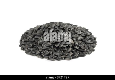 Sunflower seeds pile isolated, black sun flower grains snack, edible oil kernels heap with shell on white background Stock Photo