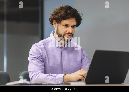 Man Working on Laptop in Office During Daytime Stock Photo