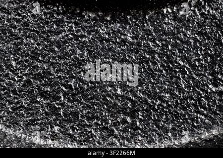 Black painted cast iron texture surface background macro close up rough metallic material dark backdrop pattern, structure industrial solid gritty coa Stock Photo