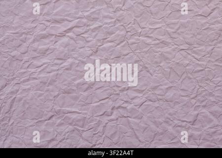 Crumpled light purple paper texture background with wrinkles and folds for design template Stock Photo