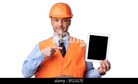 Builder Showing Tablet Computer Pointing Finger At Screen, White Background Stock Photo