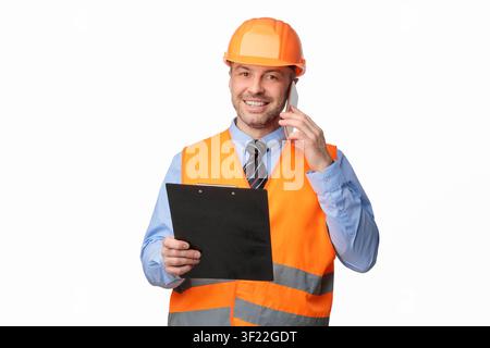 Repairman Talking On Cellphone Smiling To Camera Over White Background Stock Photo