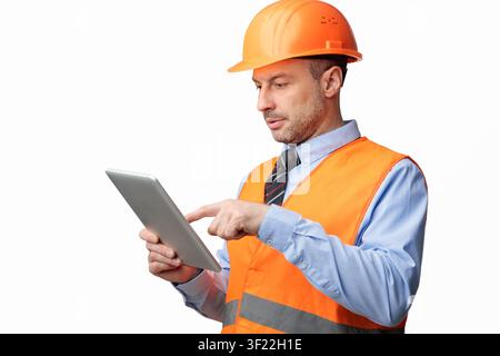 Building Engineer Using Digital Tablet Computer, Studio Shot Stock Photo