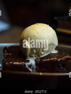 Chocolate Brownie with Vanilla Ice Cream and Rich Chocolate Sauce Stock Photo