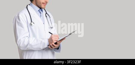 Unrecognizable male therapist writing notes to patient's medical history Stock Photo
