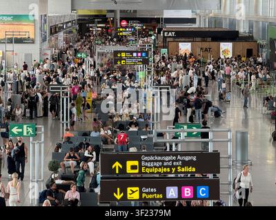Malaga airport, Andalusia, Spain. 11th July 2026. Travellers crowd the departure lounge at Malaga airport in Spain. Stock Photo