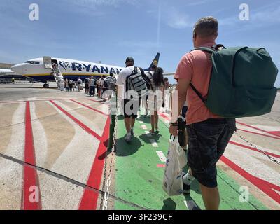 Malaga airport, Andalusia, Spain. 11th July 2026. Pictured: Passengers board a Ryanair airplane at Malaga airport. Stock Photo