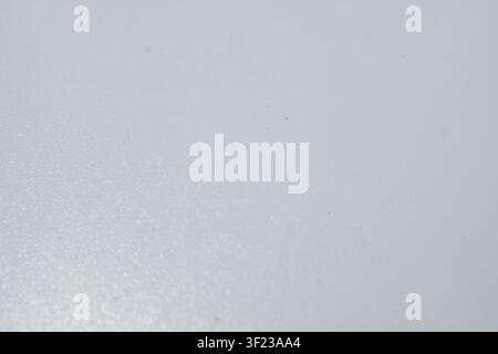 Blank light grey material showing subtle grain and details under soft studio lighting Stock Photo
