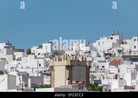 View of the whitewashed townscape of Conil de la Frontera, Cadiz, Spain, with dense traditional buildings and characteristic Andalusian coastal archit Stock Photo