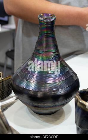 Vase created using 3D metal printing. Metal model printed on 3D printer. Created using additive manufacturing from melted metal thread. Additive manufacturing. Object printed on 3D printer from metal. Stock Photo